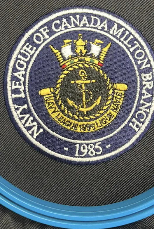 Circular navy and gold embroidered badge