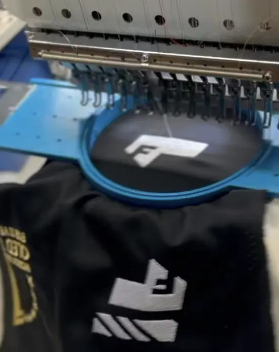 Minimal white logo embroidered on a black cap
