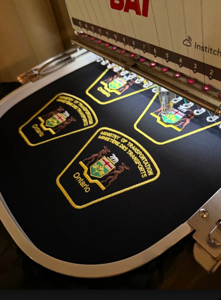 Ontario Ministry of Transportation shoulder patches being embroidered